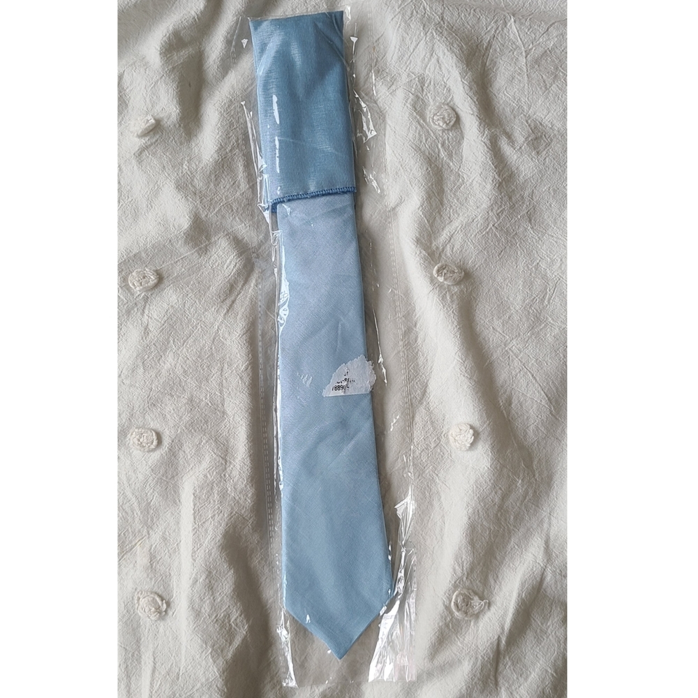 Light blue tie and pocket square sets, new and unused, in original packaging